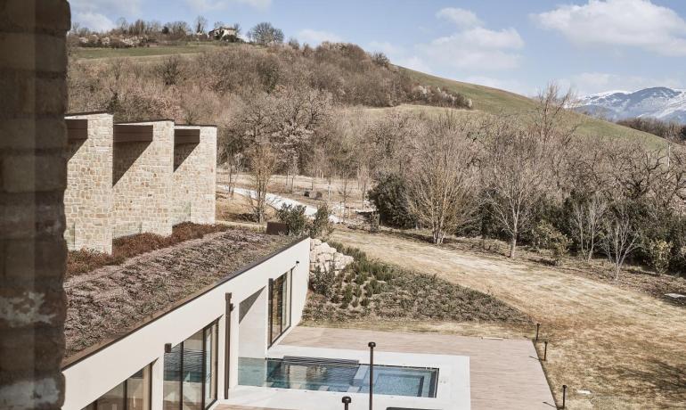 View of pool and hills, clear sky.